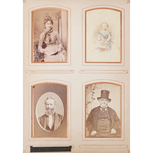 2248 - A Victorian leather bound album with black and white portrait photographs, various subjects and size... 