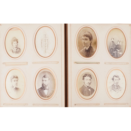 2248 - A Victorian leather bound album with black and white portrait photographs, various subjects and size... 