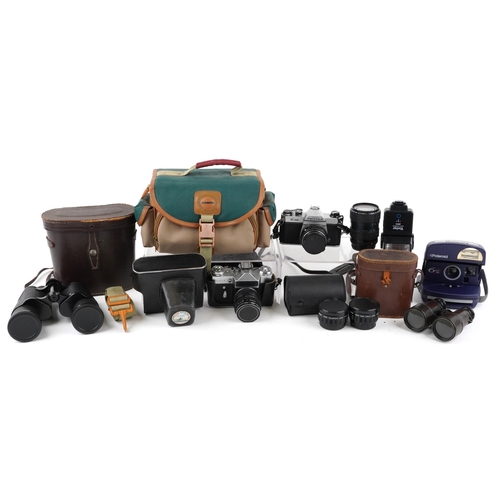 1008 - A group of various cameras and binoculars including a Pentax K1000, a Polaroid 600AF, a Zenit-E, a p... 