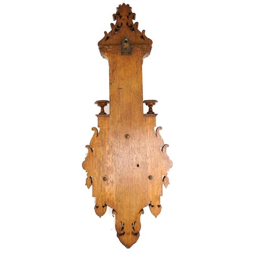 2168 - A late Victorian carved oak wall hanging barometer, 95cm in length.