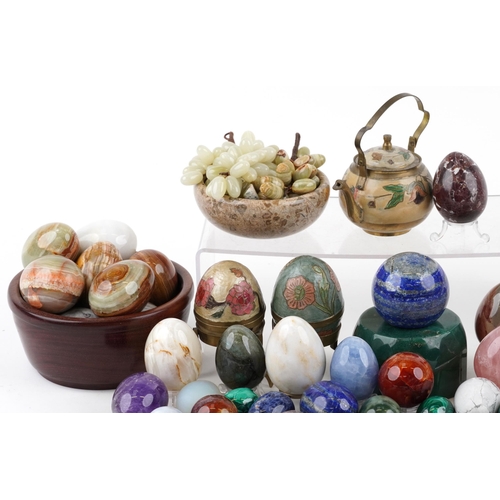 1109 - A large collection of polished stone rock and mineral specimens and marbles including amethyst, rose... 