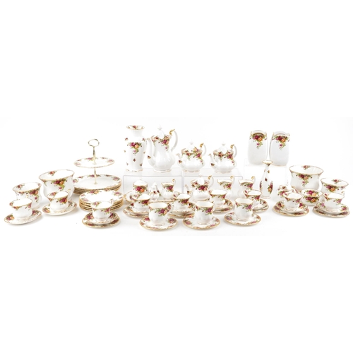 A large collection of Royal Albert Old Country Roses tea/coffee and dinnerware including teapots, coffee pot, dinner plates, cake stand and vases.