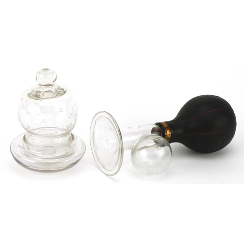 377 - A glass and gutta percher breast pump, glass nipple shield & cup, the breast pump 6cm in diameter, w... 