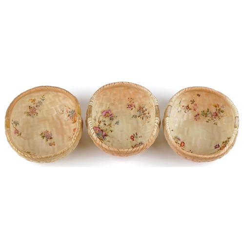  A near pair of Royal Worcester blush porcelain and gilt and hand painted ozier bowls of compressed c... 