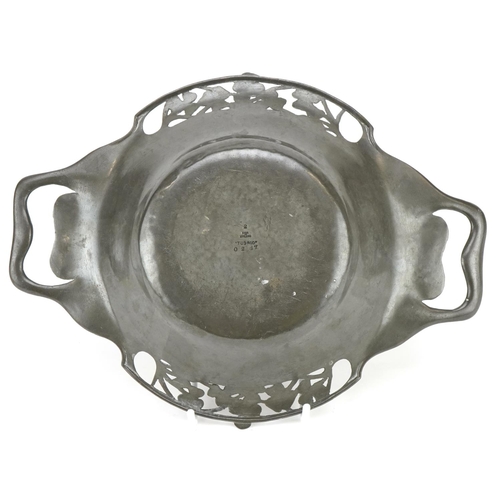 11 - A Tudric pewter Art Nouveau bowl circa 1900, with overall hammered finish, piereced swirling handles... 