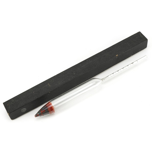 376 - An unusual glass hydrometer, with a lead weighted tip, detailed in red 22170, the paper scale 9cm lo... 