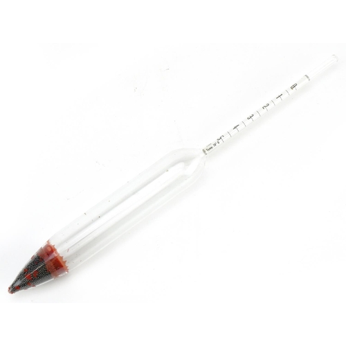 376 - An unusual glass hydrometer, with a lead weighted tip, detailed in red 22170, the paper scale 9cm lo... 