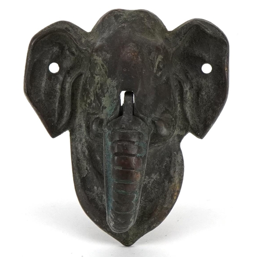 409 - A late Victorian cast bronze door knocker in the form of an Elephant, H-9cm.