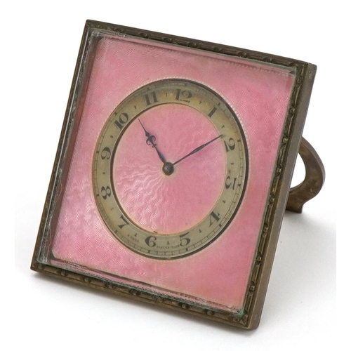 96 - An Edwardian pink enamel & gilt bronze strut timepiece, circa 1920, the 4.5cm chapter ring with Arab... 