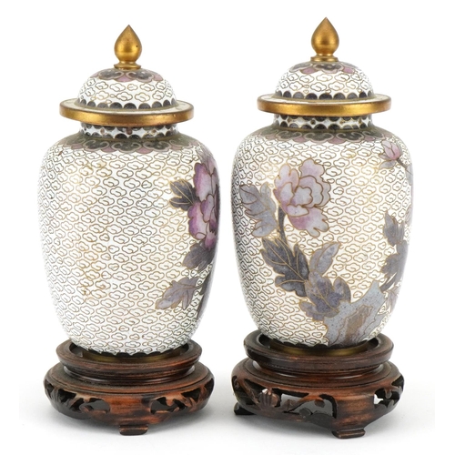 1195 - A pair of Japanese cloisonné diminutive vases and covers, 20th century, raised on wooden bases, over... 