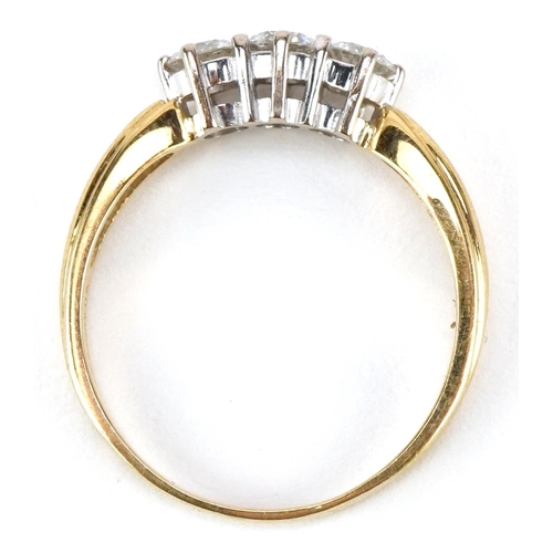 3002 - An 18ct gold diamond trilogy ring, total diamond weight approximately 0.75 carat, size T/U, 3.8g.