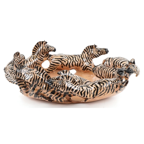 1081 - A studio pottery bowl in the form of zebras by Clive Fredriksson, 48cm wide.