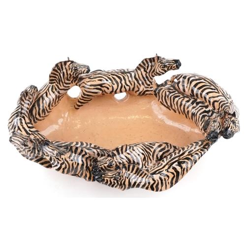 1081 - A studio pottery bowl in the form of zebras by Clive Fredriksson, 48cm wide.