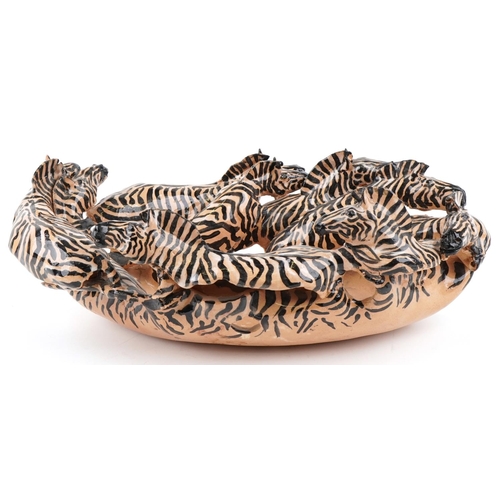 1081 - A studio pottery bowl in the form of zebras by Clive Fredriksson, 48cm wide.