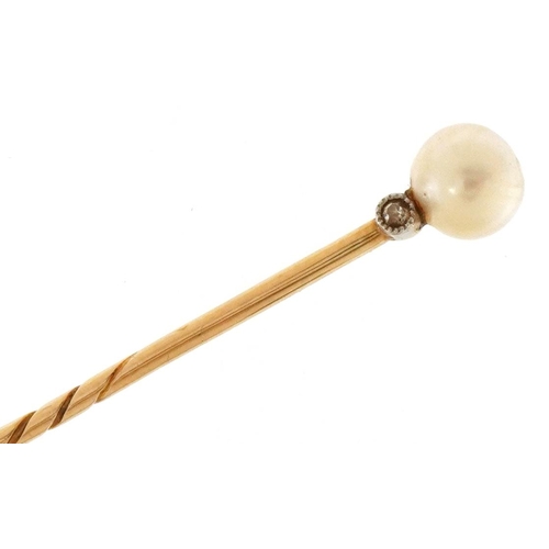 3382 - An unmarked gold cultured pearl and diamond stickpin, 6.6cm in length, 1.3g, housed in a Gass & Co L... 