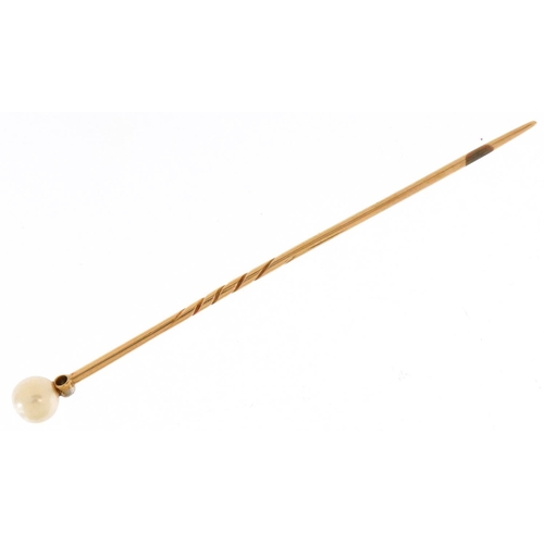 3382 - An unmarked gold cultured pearl and diamond stickpin, 6.6cm in length, 1.3g, housed in a Gass & Co L... 