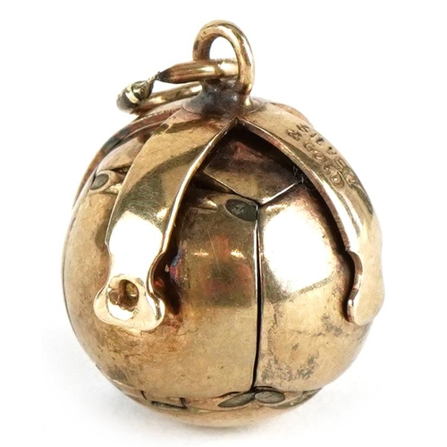 3092 - A 9ct gold cased silver folding masonic ball pendant, 4.2cm high when open, 9.0g.