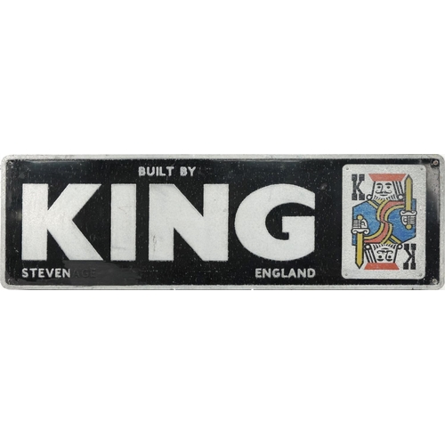 2272 - A 20th century black enamel sign detailed Built by King, Stevenage, England, decorated with a playin... 