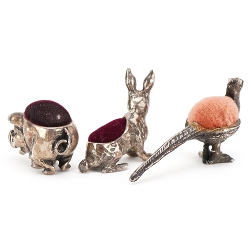 90 - Three miniature silver pin cushions in the form of a pheasant, rabbit and pig, the largest 4.5cm in ... 