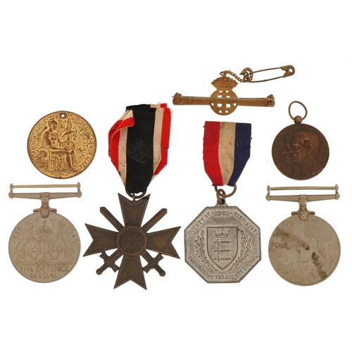 2410 - Militaria including a German military interest War Merit design cross with swords, British military ... 