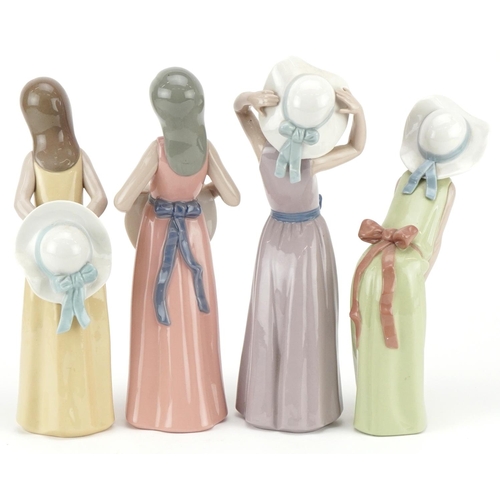 472 - Four Lladro figurines of young girls with hats, the largest 26cm high.