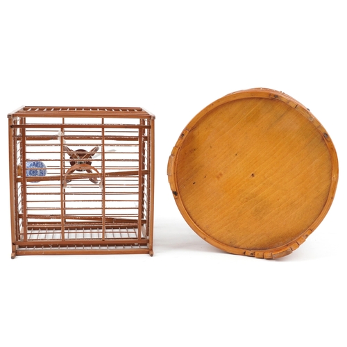 1086 - Two Chinese softwood decorative bird-cages, 20th century, one cylindrical, the other of square form,... 