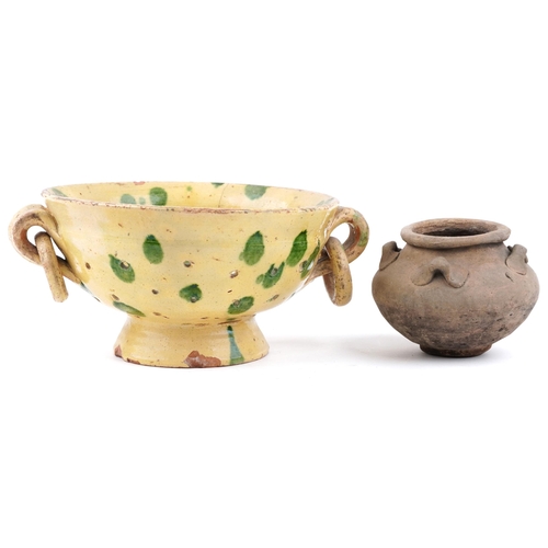 425 - A mid 20th century yellow glazed terracotta two handled sieve, 25cm in diameter together with a terr... 