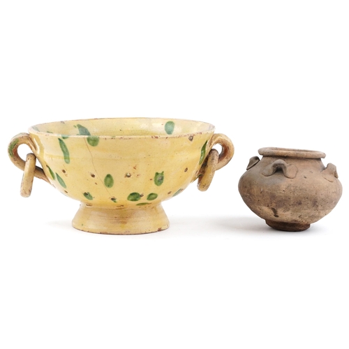 425 - A mid 20th century yellow glazed terracotta two handled sieve, 25cm in diameter together with a terr... 