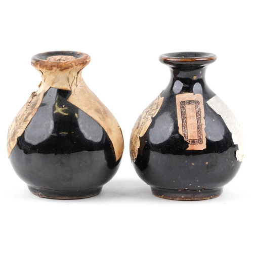 414 - A Wing Lee Wai, Hong Kong prohibition liquor ceramic bottle, 9cm high, together with a similar Kae F... 