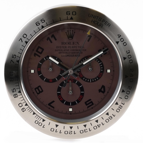 1062 - A Rolex Daytona dealer's display wall clock, 34cm in diameter.