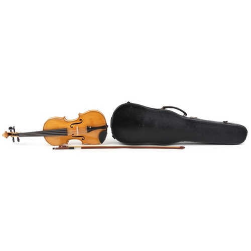 1042 - A child's wooden violin and bow housed in a fitted protective case, the violin back 13.5 inches in l... 