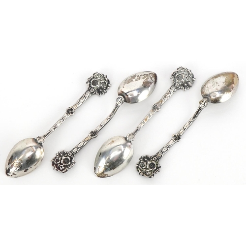 578 - A set of four 835 grade teaspoons with naturalistic terminals, 9cm in length, total 33.0g.