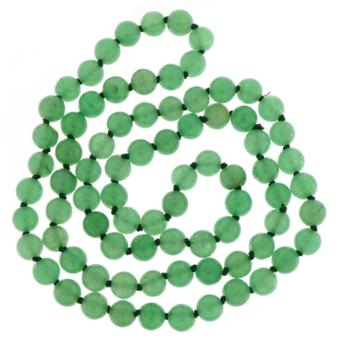 3668 - A Chinese green jade bead necklace, each bead 8.2mm in diameter, 70cm in length, 58.6g.