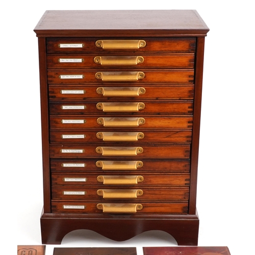 159 - A late 20th century mahogany twelve drawer printer's cabinet containing an extensive collection of p... 