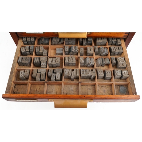 159 - A late 20th century mahogany twelve drawer printer's cabinet containing an extensive collection of p... 