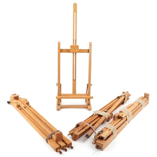 1317 - Four late 20th century teak folding artist's easels, variously sized.