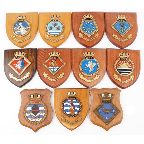 2500 - A collection of eleven naval interest shield shaped wall plaques including H.M.S. Heron, H.M.S . Eng... 