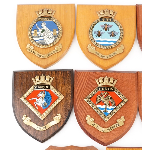 2500 - A collection of eleven naval interest shield shaped wall plaques including H.M.S. Heron, H.M.S . Eng... 