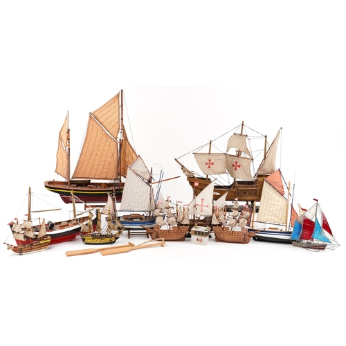 1066 - A collection of various 20th century scratch built model yachts, variously sized, each with sails an... 