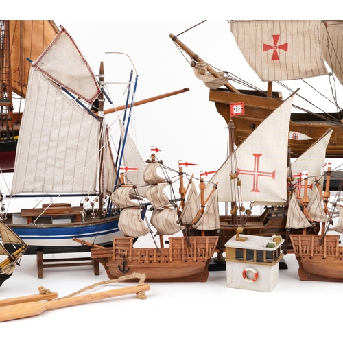 1066 - A collection of various 20th century scratch built model yachts, variously sized, each with sails an... 