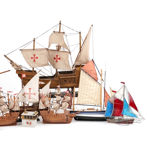 1066 - A collection of various 20th century scratch built model yachts, variously sized, each with sails an... 