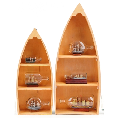 1067 - A group of eight late 20th century glass ships in bottles, variously sized, the largest 24cm wide, t... 