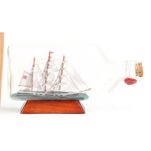 1067 - A group of eight late 20th century glass ships in bottles, variously sized, the largest 24cm wide, t... 