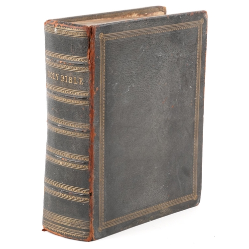 2353 - A Holy Bible, Haydock's Edition circa 1850, with engraved leaves, leather bound, 26cm wide.