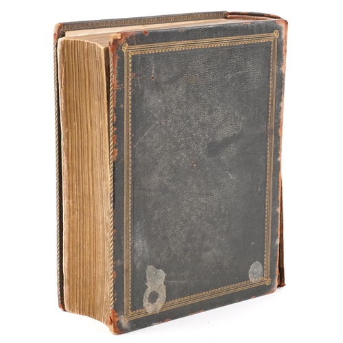 2353 - A Holy Bible, Haydock's Edition circa 1850, with engraved leaves, leather bound, 26cm wide.