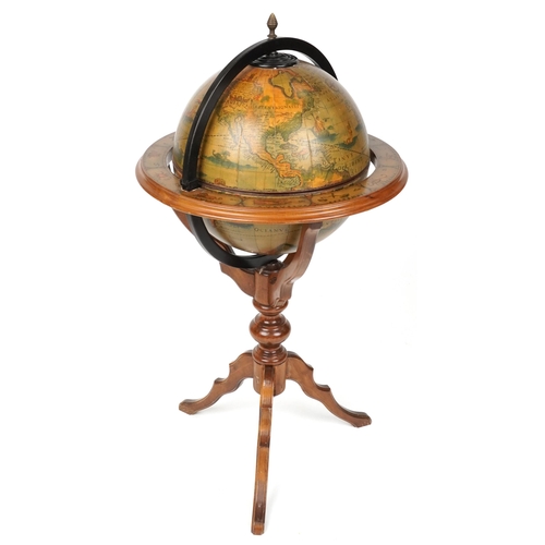 2023 - A late 20th century beech framed drinks terrestrial globe, the hinged top revealing a compartmentali... 