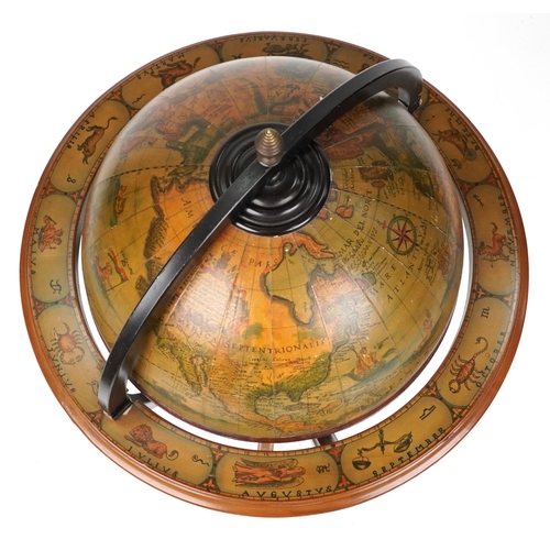 2023 - A late 20th century beech framed drinks terrestrial globe, the hinged top revealing a compartmentali... 