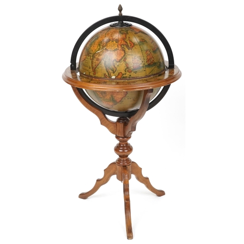 2023 - A late 20th century beech framed drinks terrestrial globe, the hinged top revealing a compartmentali... 