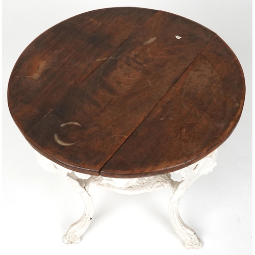 2020 - A late 19th century white painted cast iron pub table, the later circular top above pierced foliate ... 