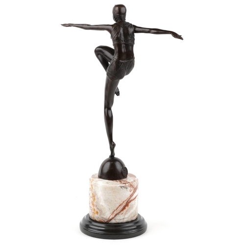 338 - A patinated bronze study of an Art Deco female dancer raised on a marble column base, 55cm high.